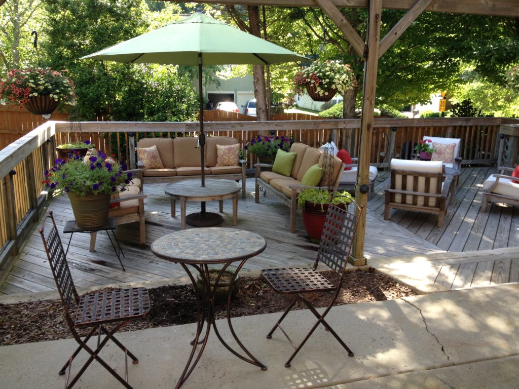 Make your patio an outdoor room with comfy seating under the shade.