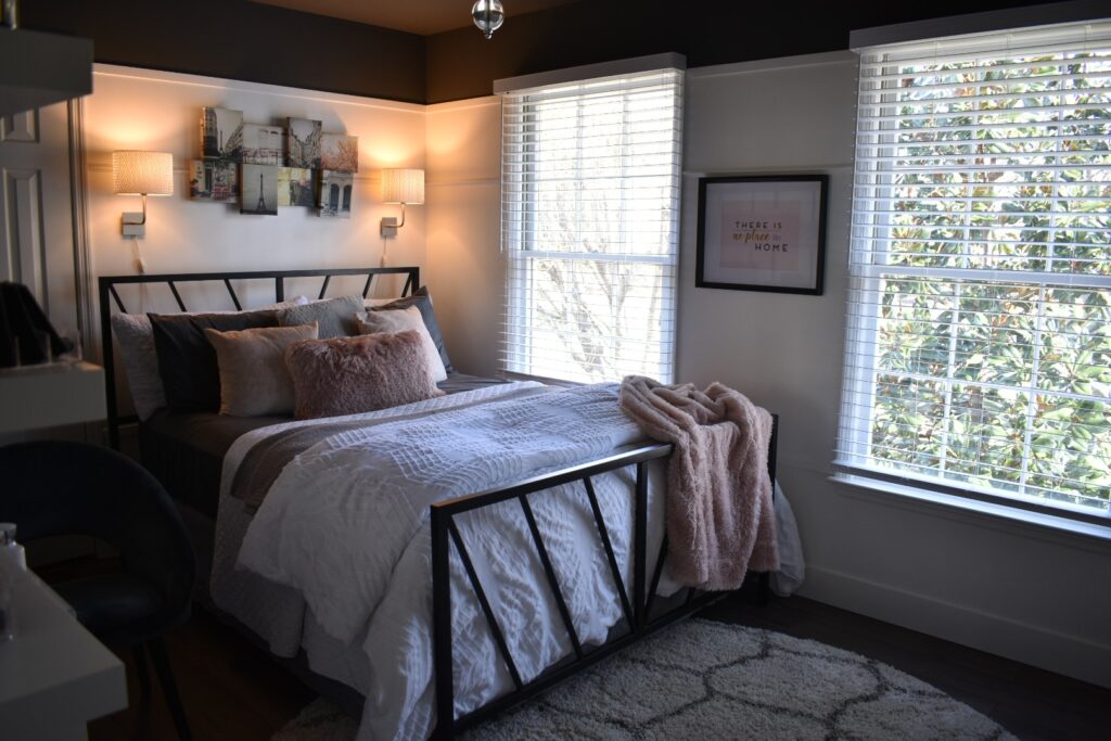 Small bedroom makeover with dark ceilings and bright white walls.